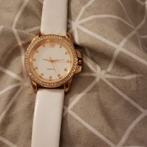 Quarts watch, white with gold accents.